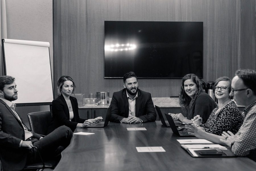About Our Agency - Three Arbor Insurance Team Working Together In A Meeting